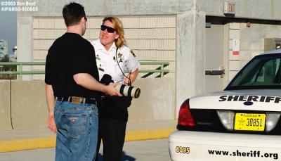 2003 - Joe Pries and Broward Sheriffs Deputy at FLL