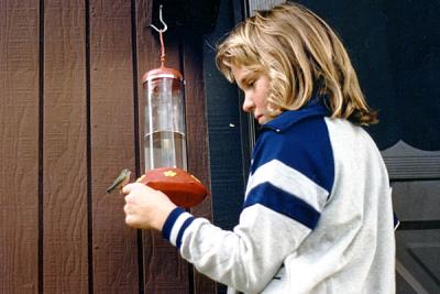 1988 - Karen and hummingbird on her finger at Brenda's home