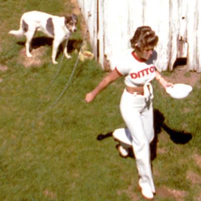 1975 - feeding her dog before dashing off for a Dittos modeling job
