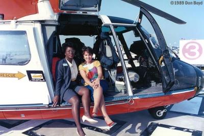 1989 - YN3 Cynthia R. Murray (left) and HS3 (need name) with USCG HH-65A #CG-6556 at Miami International Airport