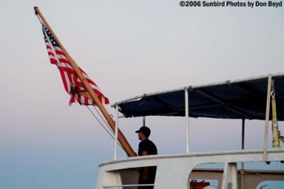 2006 - Evening colors at the stern of the Coast Guard Cutter GENTIAN (WIX 290) stock photo #9331