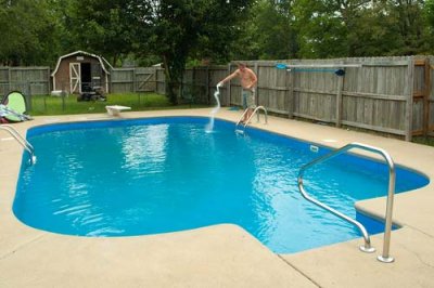 2006 - Nephew David adding chlorine to his backyard pool