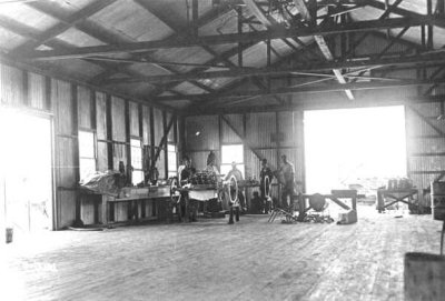 1917 - Mechanics working on a Curtiss Jenny OX5 engine at Curtiss Air School hangar