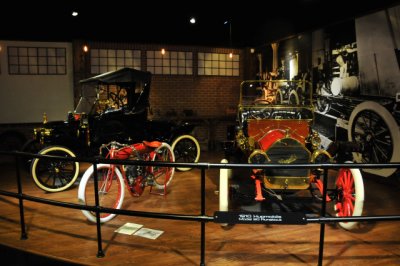 From right: 1910 Hupmobile Model 20 Runabout, Indian motorcycle, 1914 Ford Model T Runabout (1907)