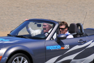 Dan Gurney, 79, being driven by son Alex around the Mazda Raceway Laguna Seca in a Mazda MX-5 Miata (2813)