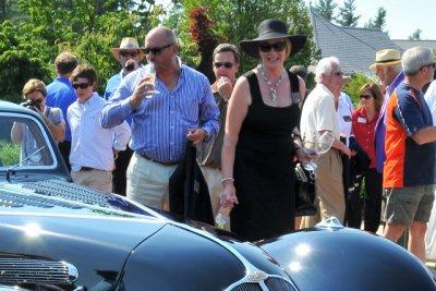 Pebble Beach Concours Chairman Sandra Button, in black, and husband Martin Button, in stripes, were among the judges. (4830)