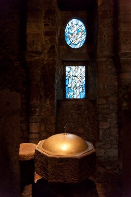 Baptismal font in pink granit