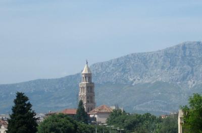 the tower of diocletian's palace against the mountains
