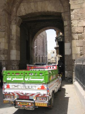truck pushing through the crowds at the bazaar - bab azwayla gate