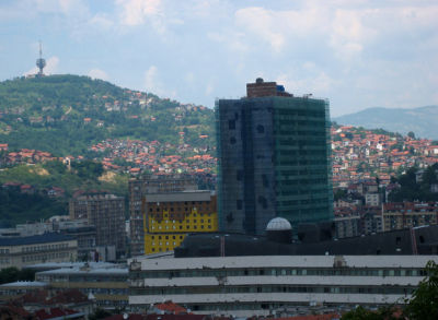 war-damaged parliament building and the yellow holiday inn