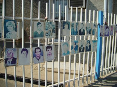 photos of dead and missing kosovars outside government offices