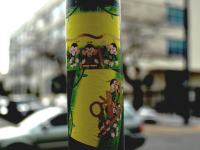 stickers on pole in front of my cafe