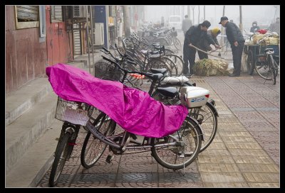 Bicycle Raincoat on a Foggy Day