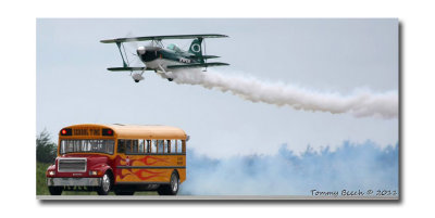 Jason Newburg's Pitts S2S races with Paul Stender's School Time Jet bus