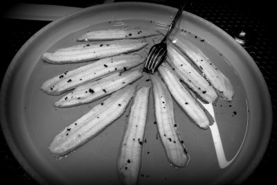 fork in a plate of anchovies