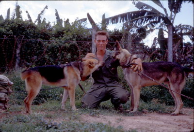 Sgt. Bill Berg with Scout Dogs Missy and Sam