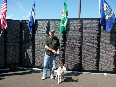Dave Baker is with his beloved Salty, the family pooch, at the moving memorial Wall in Lincoln City, Oregon.