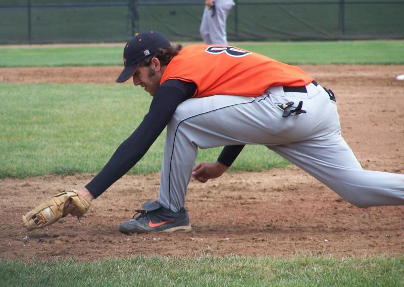 matt stretches to scoop the throw