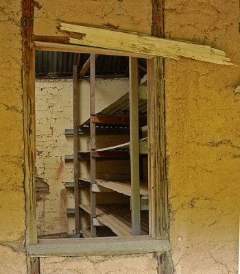 Shelves in Rammed Earth Homestead