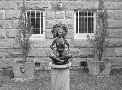 A Bronze, Three Faces and Sandstone BW