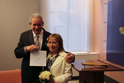 Moshe and Orna showing their marriage certificate to their guests - after the wedding ceremony. 
