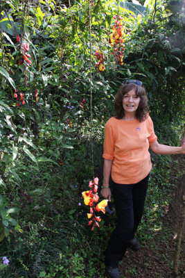 Judy next to beautiful wild orchids