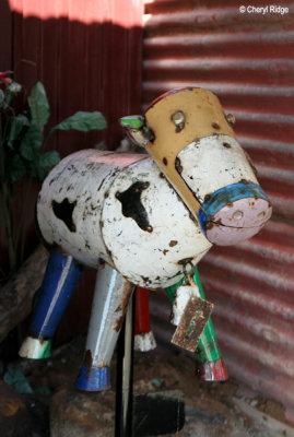 8601- Town of Rainbow  - cow sculpture
