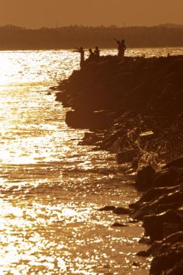 Fishing on the tip of the rock