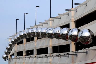 Silver baseballs adorn a parking garage