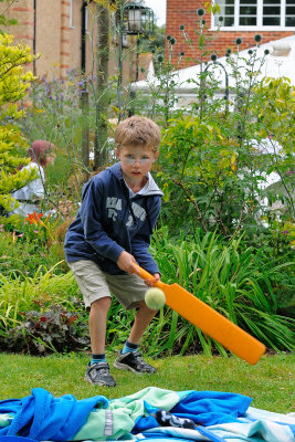 Cricketer Tom plays a cover drive