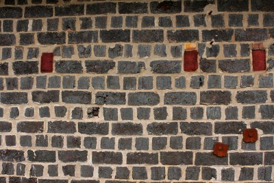 Wall of slid bricks.