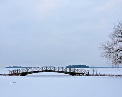 Boardwalk bridge by lake Mälaren.