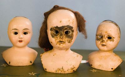 Old tin doll heads