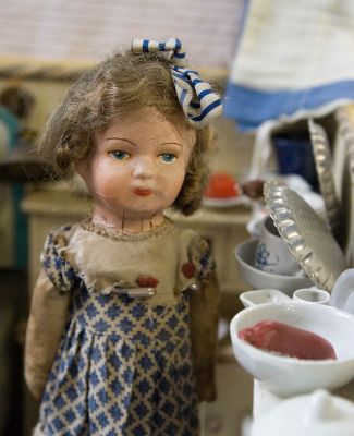 Doll in puppet kitchen