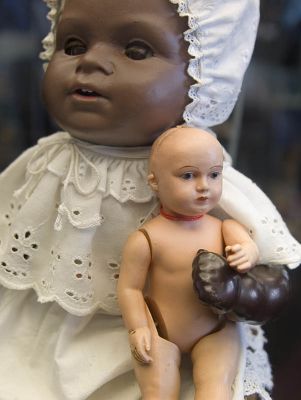 Black doll with white baby doll
