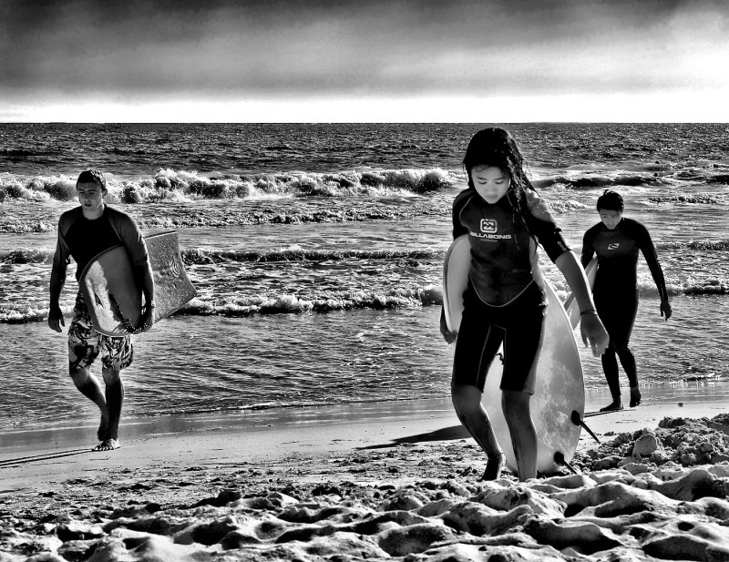 Tired Surfers Returning To Shore