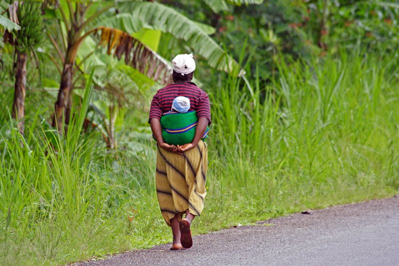 Woman carrying baby