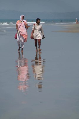 Two Indian Women Walking Along Beach Mandrem