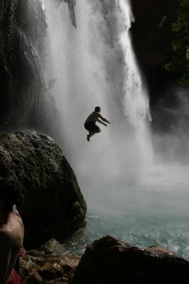 Greg jumping off something higher than a chair