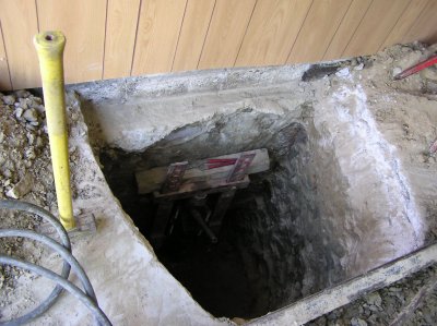 When the pipe is in place, a brace goes under the foundation.