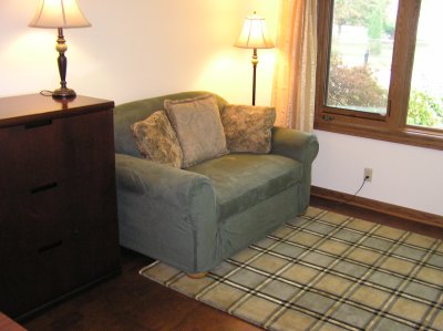 Loveseat covered with slipcover from Sure Fit, and rug from the Hagopian Outlet.