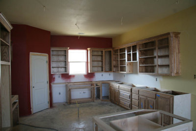 The kitchen cabinets are installed - now we just have to finish the staining!  (our never ending project ...)