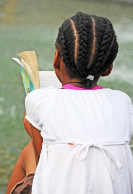 Reading a Book at the Fountain