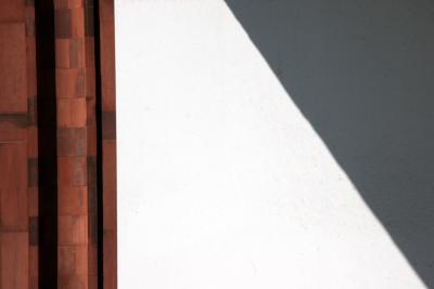 Shadows on a Red Sandstone Wall and a White Terrace Panel