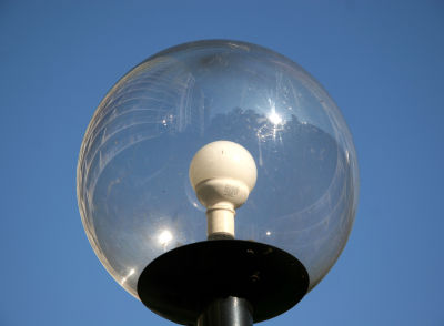 Washington Square Village Reflection  in a Garden Light Bulb