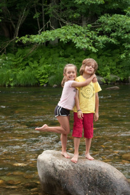 All that our kids need for hapiness is some body of water with rocks in it.