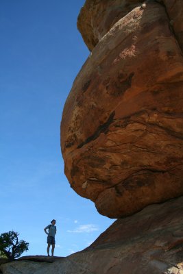 Crystal getting dwarfed by the giant balancing rock