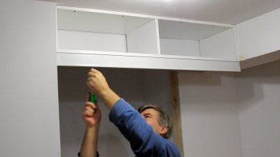 First we put the top cupboard up
