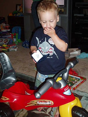 Blowing on his new silver dollar