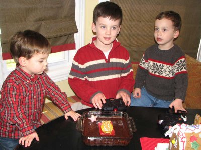 Hutton, Cade, Reid with cake for Baby Jesus